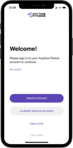 iPhone on the welcome page of the anytime fitness app directing user create account